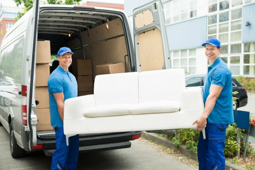 Packed moving boxes and furniture ready for a Belgravia move