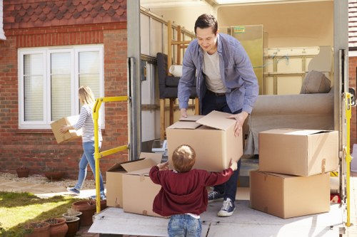 Packed moving boxes and furniture for a Belgravia home relocation