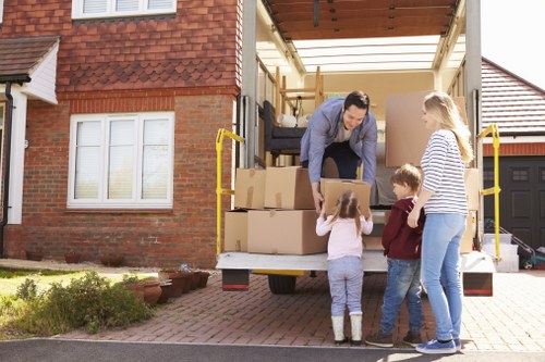 Removal team handling boxed household items during a UK move