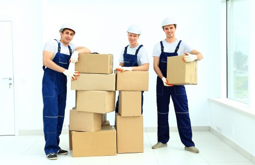 Professional moving team handling items for a Belgravia customer