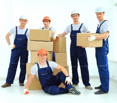 Removal crew loading items for a Belgravia office or flat move