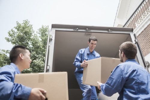 Removal van and moving team preparing a Belgravia house move