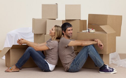 Moving boxes and wrapped furniture prepared for transport in Belgravia